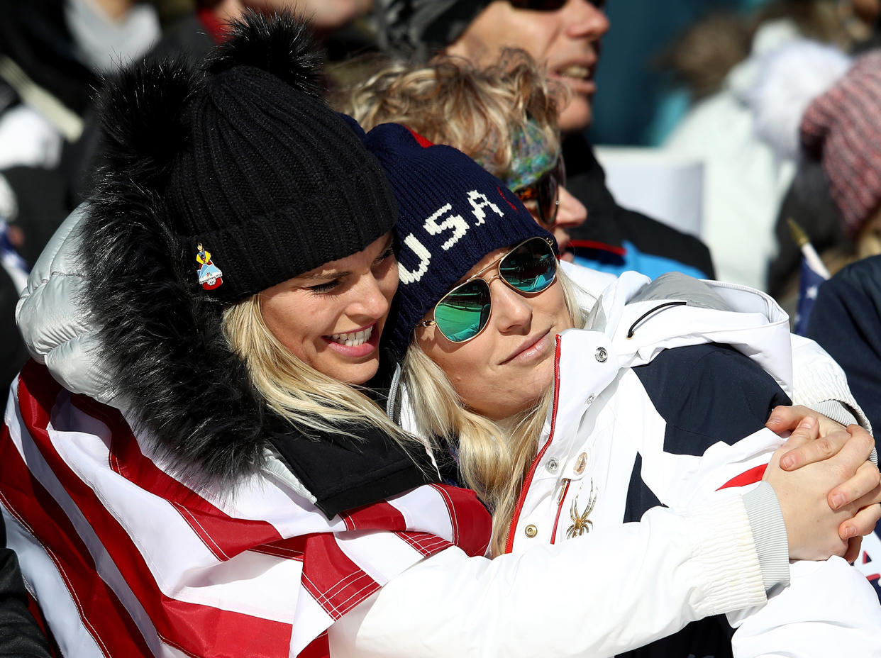 Lindsey Vonn (R) is consoled after missing out on a medal: Getty