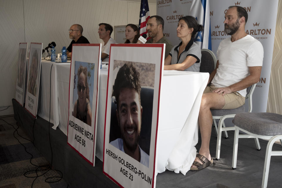 Relatives of U.S. citizens that are missing since Saturday's surprise attack by Hamas militants near the Gaza border, in Tel Aviv, Israel attend a news conference on Tuesday, Oct. 10, 2023 in Tel Aviv, Israel. Seated from left: Jonathan Dekel-Chen, father of Sagui Dekel-Chen (35) from Nahal Oz; Ruby Chen, father of Itay Chen, 19, a soldier in the armored corps; Ayala Neta, daughter, and Nahal Neta, son of Adrienne Neta, 66, a nurse living in Kibbitz Be'eri; Rachel Goldberg, mother of Hersh Goldberg-Polin, 23, who was attending the music festival, and Jonathan Polin, Hersh's father. (AP Photo/Maya Alleruzzo)