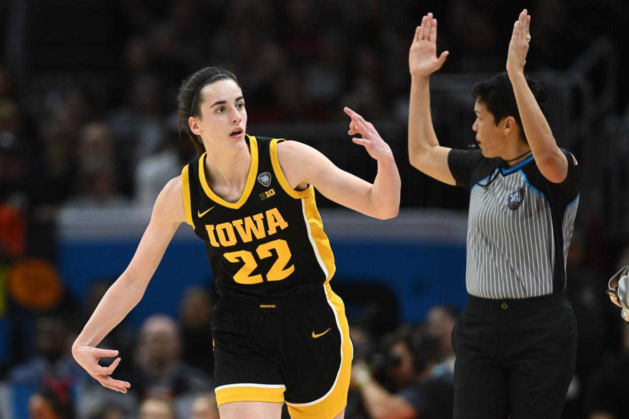 Iowa guard Caitlin Clark (22) reacts after making a 3-pointer against South Carolina in the championship of the women's 2024 NCAA Tournament at Rocket Mortgage FieldHouse.