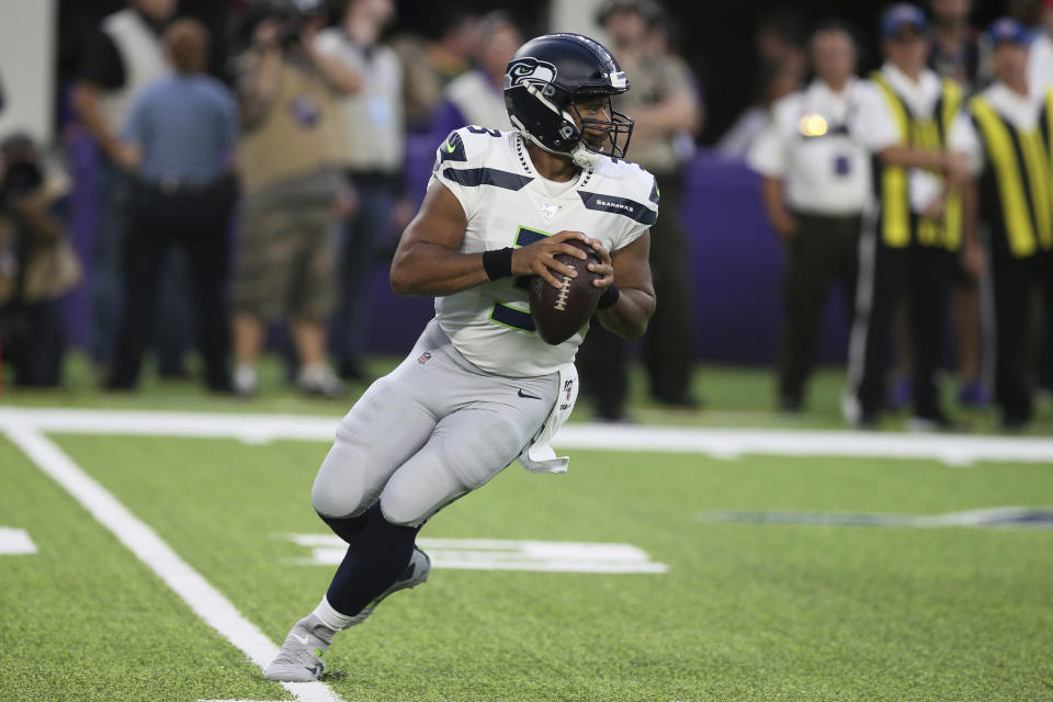 Seattle Seahawks quarterback Russell Wilson throws a pass during the first half of an NFL preseason football game against the Minnesota Vikings, Sunday, Aug. 18, 2019, in Minneapolis. (AP Photo/Jim Mone)