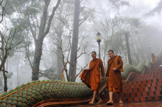 Monks at the Wat Phrathat Doi Suthep temple just outside of Chiang Mai (Getty)