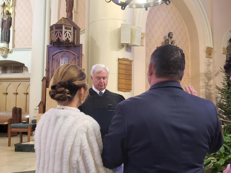 Judge Randall Bethancourt reads Terrebonne Parish President Jason Bergeron the oath of office during Mass at the Francis De Sales Cathedral, 500 Goode St. Houma, Thursday, January 4.