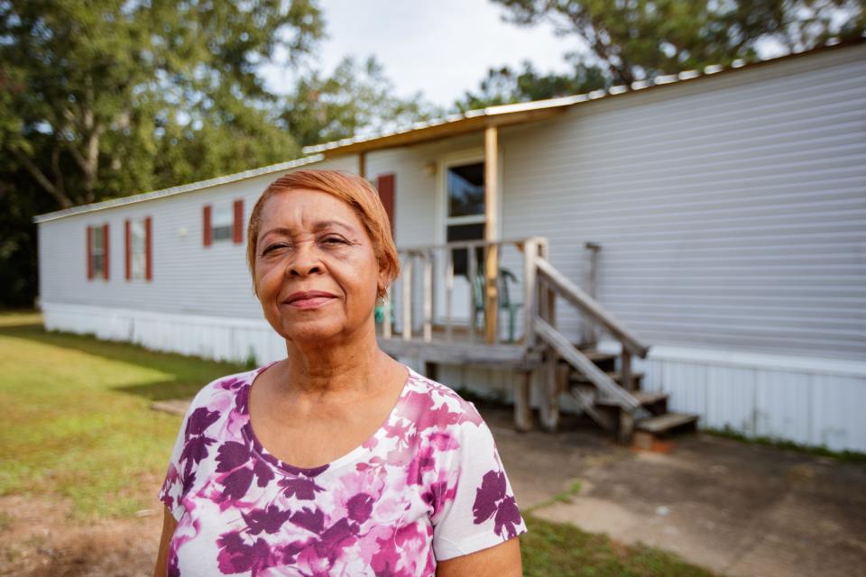 Gloria Ogden, a resident in what was formerly known as Meadows Mobile Home Park, stands in front of her home that she has to move out of due to new management significantly increasing the cost of rent Thursday, Nov. 4, 2021.