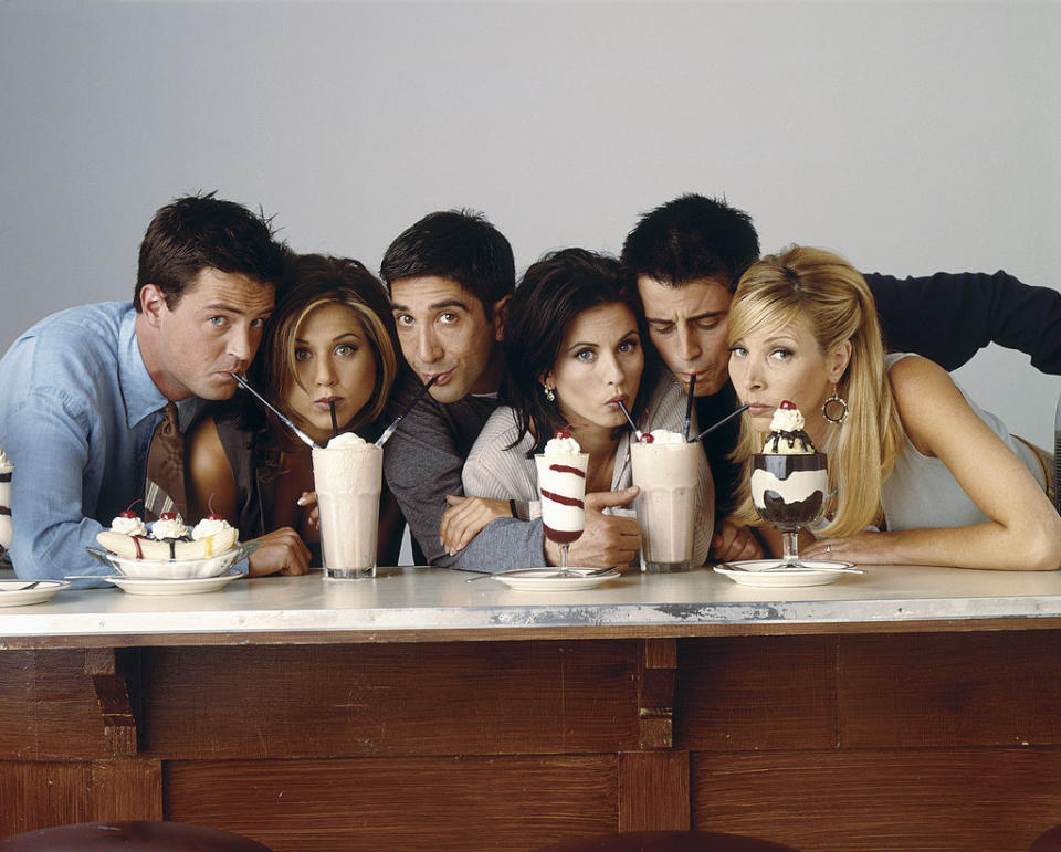 The cast of Friends sucking on straws in milkshakes