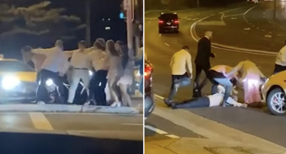 The large group of wedding guests fighting as a man appears unconscious on the ground. 