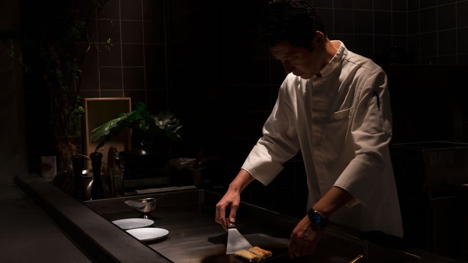 Toru Takano prepares a dish at Enishi restaurant in Hong Kong. - Noemi Cassanelli/CNN