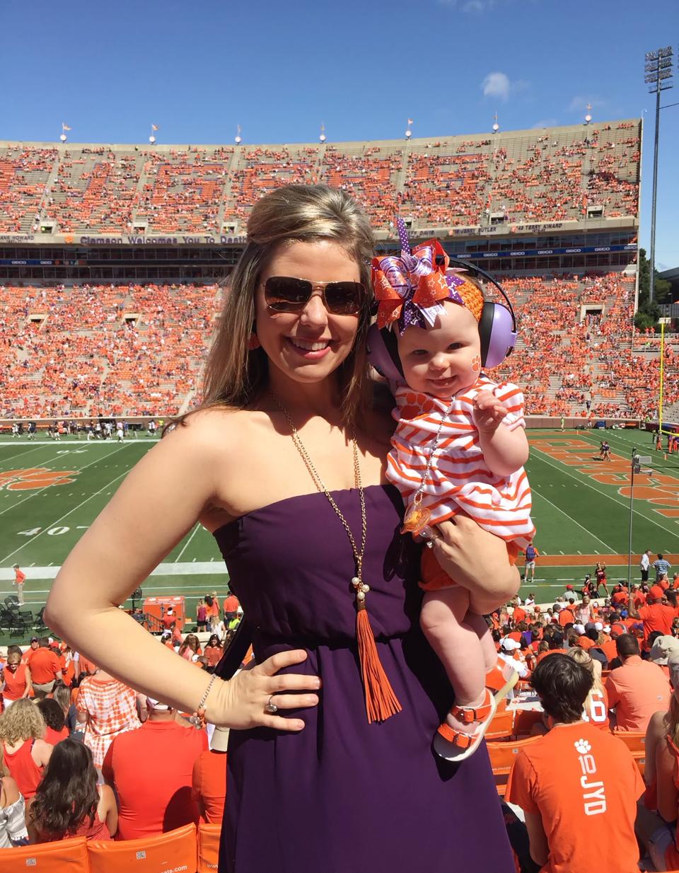 Carissa Parnell and one of her children at a Clemson University football game.