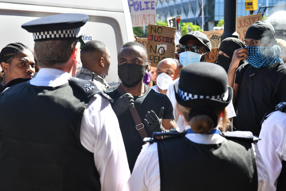 People take part in a Black Lives Matter protest outside the US Embassy in London. The protest follows the death of George Floyd in Minneapolis, US, this week which has seen a police officer charged with third-degree murder. (Photo by Dominic Lipinski/PA Images via Getty Images)