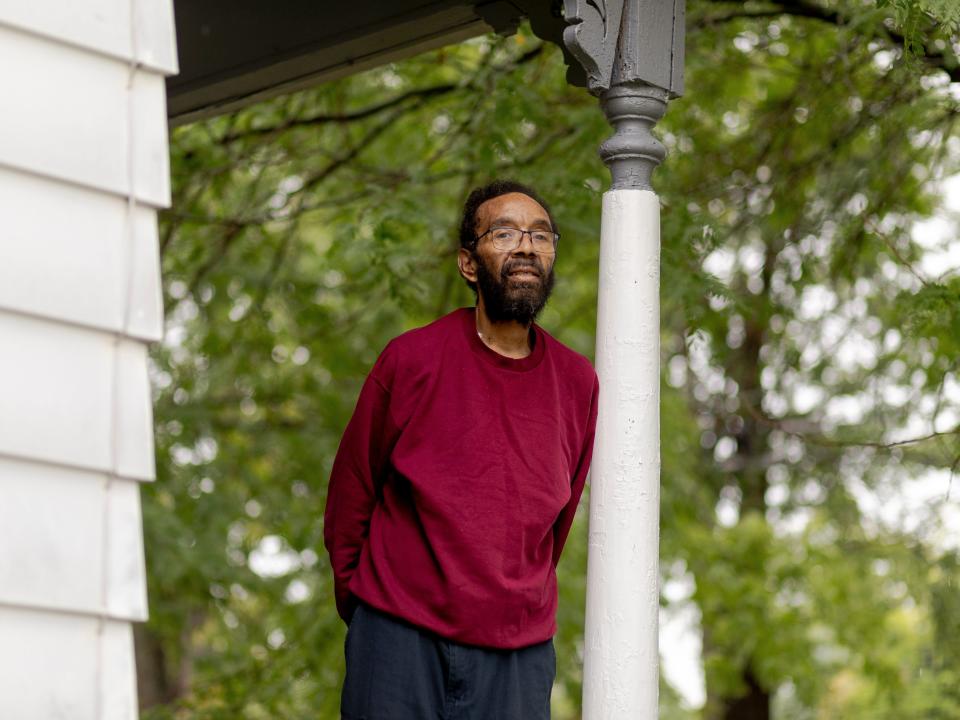 Victim William Kelly standing on a porch.