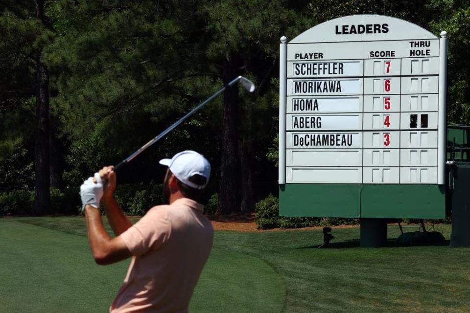 Scottie Scheffler warms up on the practice area before the final round. He was leading the tournament heading into Sunday's round.