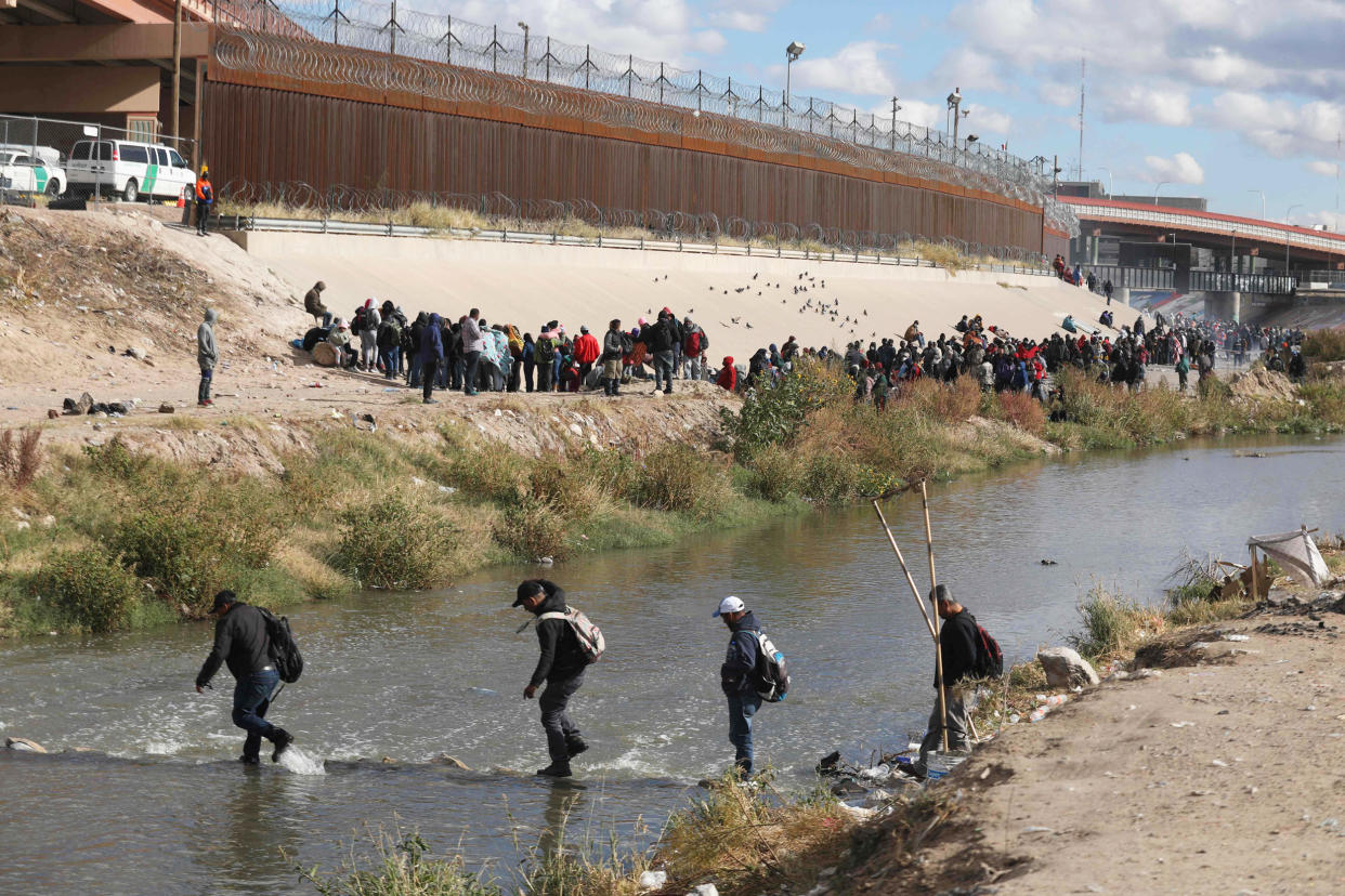 Migrants walk across the Rio Grande to surrender to US Border Patrol agents (Herika Martinez / AFP via Getty Images)