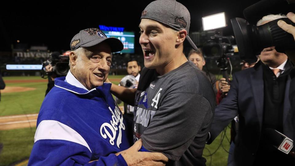 Dodgers' Kiké Hernández, right, celebrates with Tommy Lasorda after the Dodgers defeated the Chicago Cubs in the 2017 NLCS