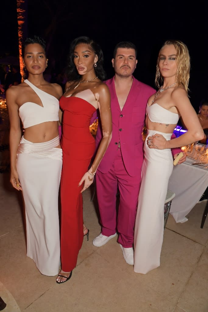 Indya Moore, Winnie Harlow, Eli Mizrahi and Cara Delevingne attend an intimate dinner hosted by Mônot at Villa Bagatelle during the 2022 Cannes Film Festival on May 25, 2022. - Credit: David M. Benett/Dave Benett/Getty Images for Monot