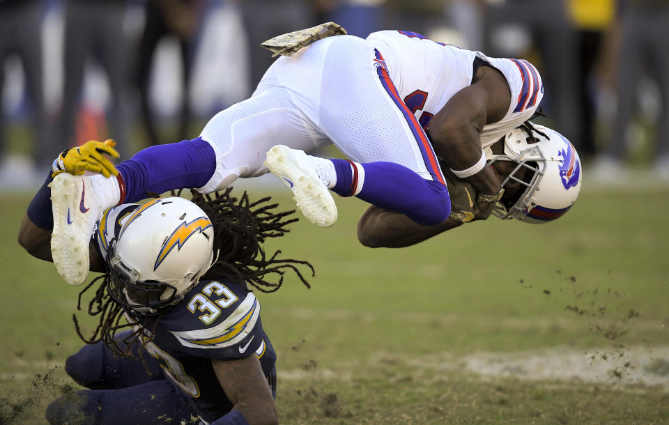 <p>Buffalo Bills running back Travaris Cadet, right, is tackled by Los Angeles Chargers free safety Tre Boston during the second half of an NFL football game Sunday, Nov. 19, 2017, in Carson, Calif. (AP Photo/Mark J. Terrill) </p>