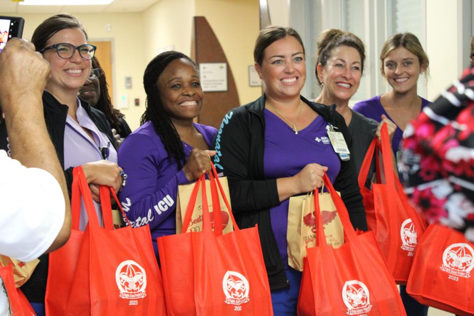 Nurses in the neonatal intensive-care unit at St. Mary's Medical Center in West Palm Beach hold the care bags that Emmanuel 'Manny' Parker distributed for his community service project on Friday, Sept. 15, 2023.