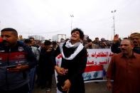 Relative reacts at funeral of demonstrator who was killed at anti-government protest overnight in Najaf