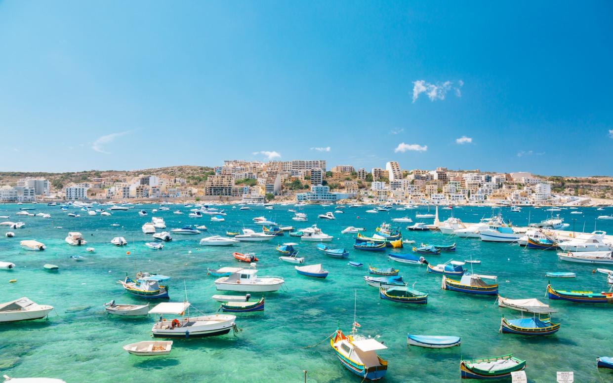 Boats in Bugibba bay, Malta - Getty