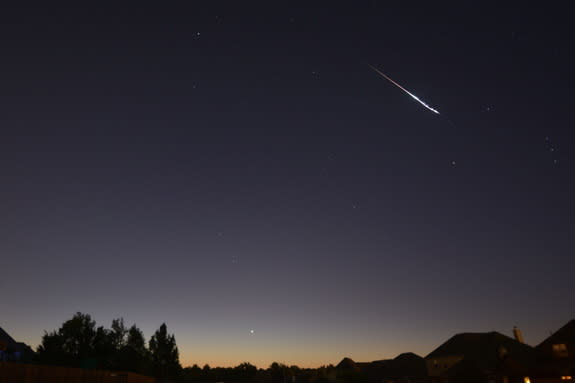 A Perseid meteor streaks over Broken Arrow, Oklahoma, in this August 13, 2014 photo by Cheryl Welch.