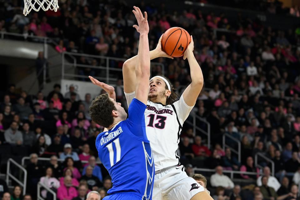 Friars forward Josh Oduro shoots over Creighton center Ryan Kalkbrenner during the first half at Amica Mutual Pavilion on Wednesday night.