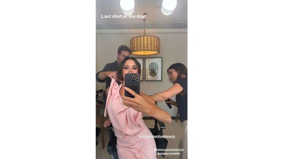 Victoria Beckham wearing a pink dress with diamond ring on Instagram Stories