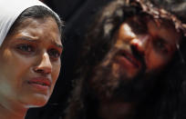 Indian Christian devotees re-enact the crucifixion of Jesus Christ to mark Good Friday in Mumbai, India, Friday, April 18, 2014. (AP Photo/Rajanish Kakade)