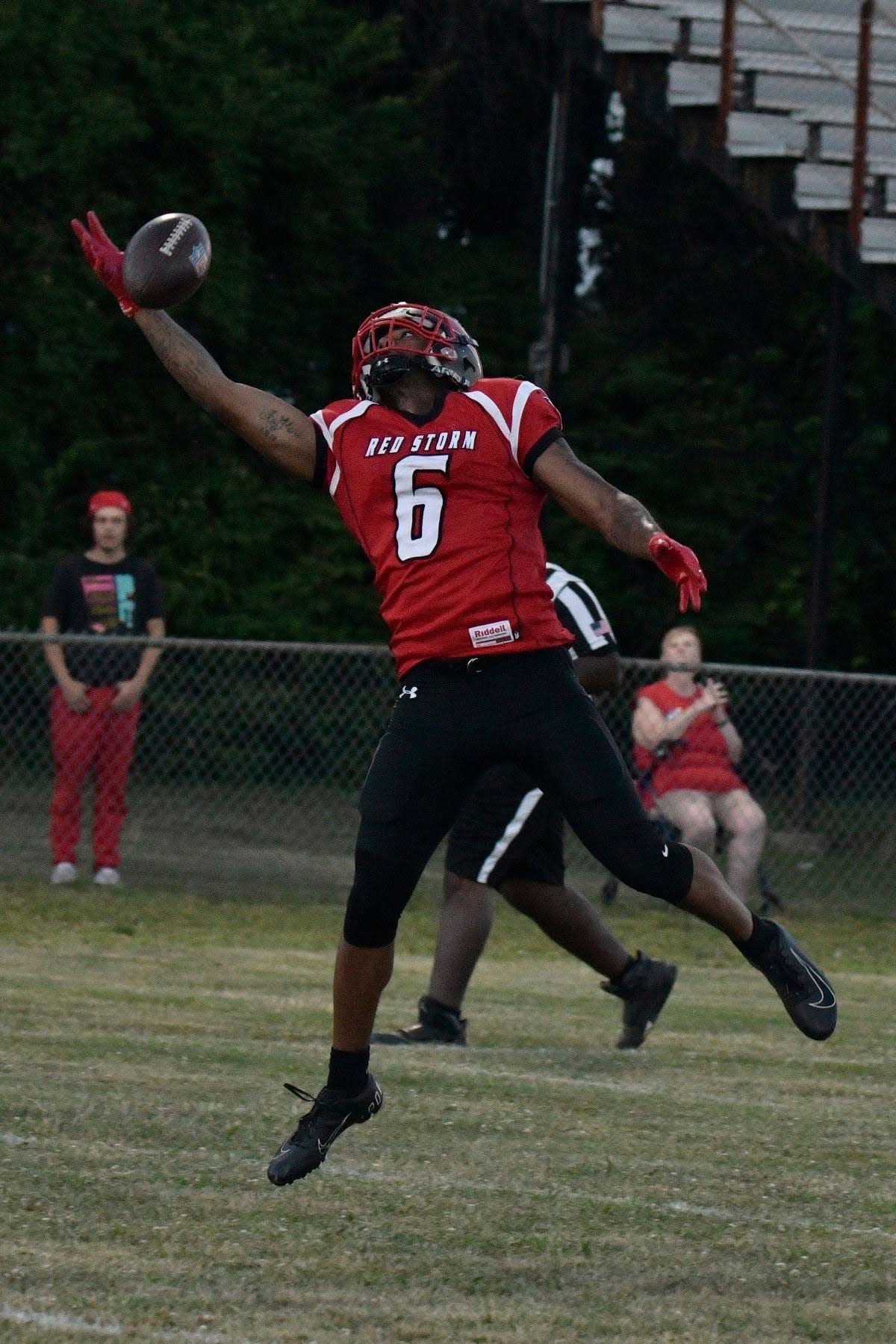 Southeast Michigan Red Storm receiver Marlon Martin Jr. extends to make a catch against the Findlay Knights on July 30.