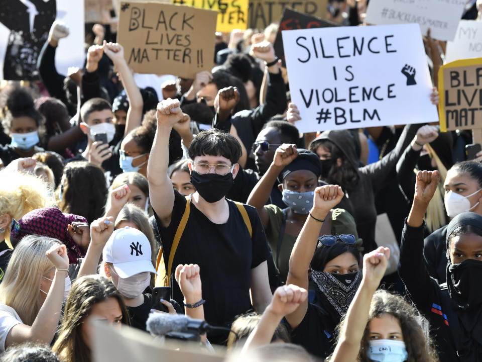 Protestors take part in a demonstration in Stockholm, Sweden, Wednesday June 3, 2020, over the death of George Floyd, a black man who died after being restrained by Minneapolis police officers on May 25. (Jonas Ekstromer/TT via AP)