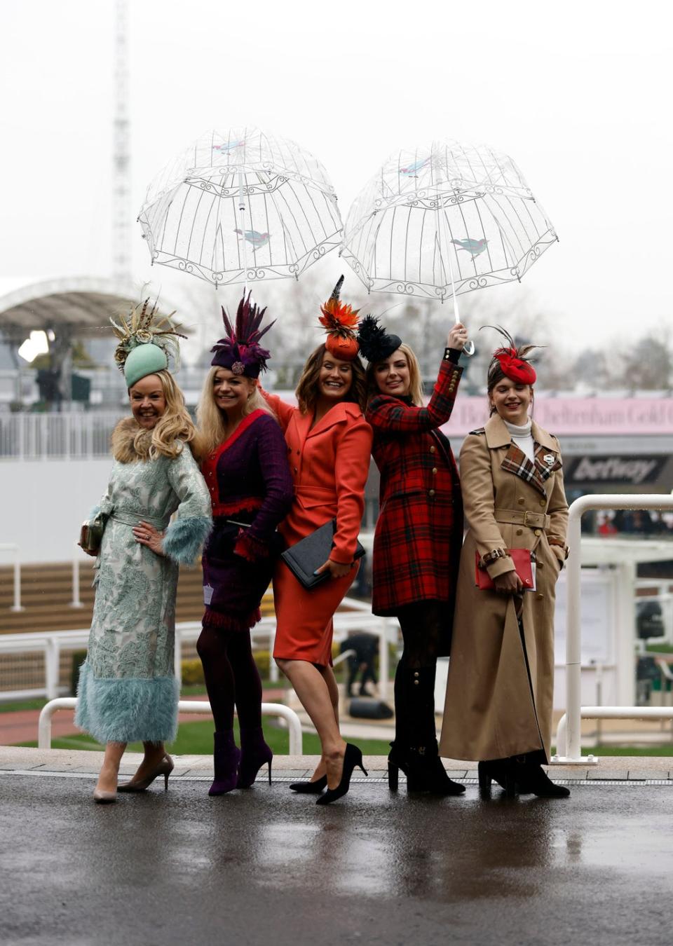 Ladies Day rain will not stop racegoers dressing up (PA)