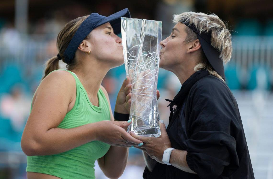 Sofia Kenin, left, and Bethanie Mattek-Sands, both from the United States, kiss their trophy after winning their women’s doubles final match during the Miami Open at the Hard Rock Stadium on Sunday, March 31, 2024, in Miami Gardens, Fla.