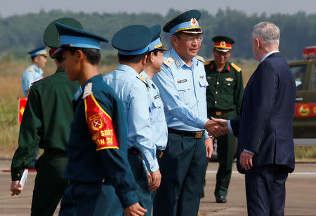 U.S. Secretary of Defense Jim Mattis (R) is greeted by Vietnam's Air Force Deputy Commander General Bui Anh Chung while he visits Bien Hoa airbase, where the U.S. army stored the defoliant Agent Orange during the Vietnam War, in Bien Hoa city, outside Ho Chi Minh city, Vietnam October 17, 2018. REUTERS/Kham/Pool