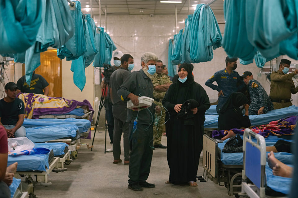 People with breathing problems are treated at a hospital during a sandstorm in Baghdad, Iraq, Monday, May 23, 2022. (AP Photo/Hadi Mizban)