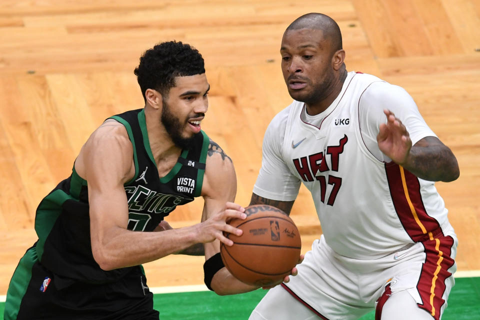 BOSTON, MASSACHUSETTS - MAY 27: Jayson Tatum #0 of the Boston Celtics looks to pass against P.J. Tucker #17 of the Miami Heat during the second half in Game Six of the 2022 NBA Playoffs Eastern Conference Finals at TD Garden on May 27, 2022 in Boston, Massachusetts. NOTE TO USER: User expressly acknowledges and agrees that, by downloading and/or using this photograph, User is consenting to the terms and conditions of the Getty Images License Agreement. (Photo by Kathryn Riley/Getty Images)