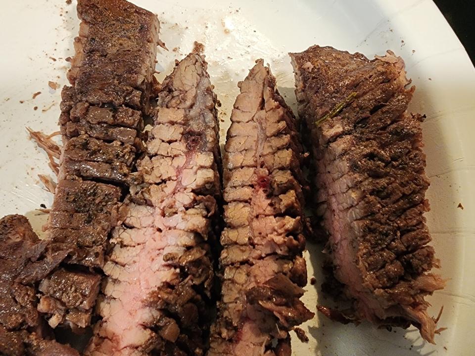 Sliced cooked steak on a plate