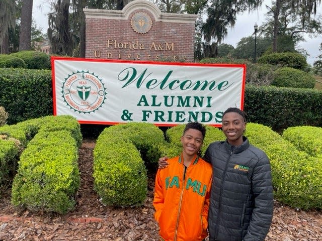 Brothers Curtis Lawrence III (left) and Corey Lawrence (right) stand on FAMU's campus during the university's annual Homecoming.