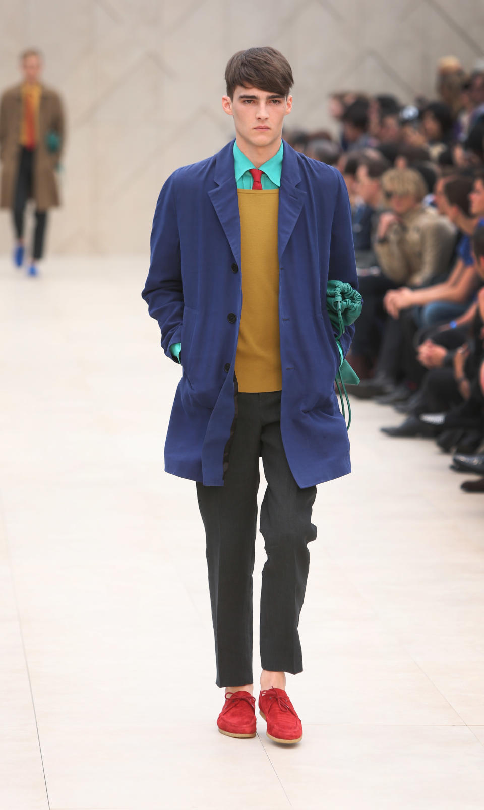 A model wears a creation by Burberry during London Men's spring summer fashion collections 2014, in London, Tuesday, June 18, 2013. (Photo by Joel Ryan/Invision/AP)