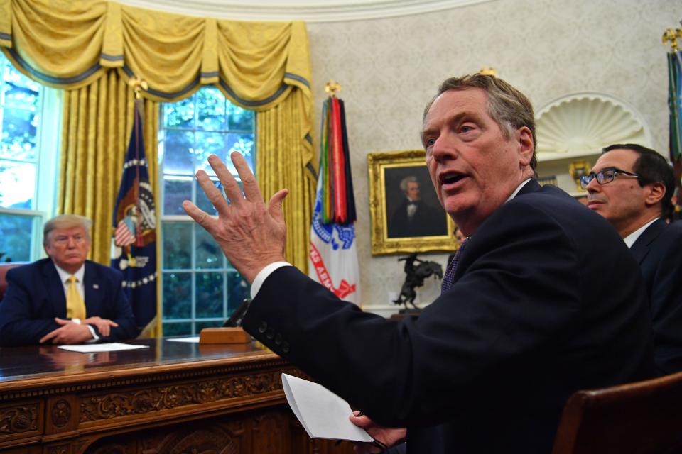 US Trade Representative Robert Lighthizer (C) speaks to the press alongside US Treasury Secretary Steven Mnuchin (R) and US President Donald Trump after announcing an initial deal with China. (Photo: NICHOLAS KAMM/AFP via Getty Images)