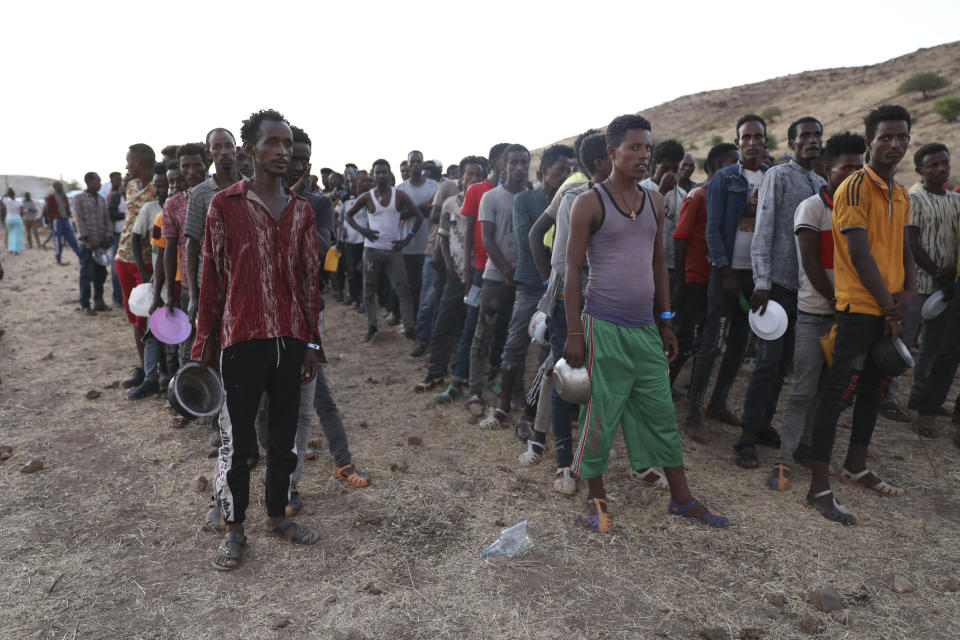 Ethiopian refugees gather in Qadarif region, easter Sudan, Tuesday, Nov. 17, 2020. The U.N. refugee agency says Ethiopia's growing conflict has resulted in thousands fleeing from the Tigray region into Sudan as fighting spilled beyond Ethiopia's borders and threatened to inflame the Horn of Africa region. (AP Photo/Marwan Ali)