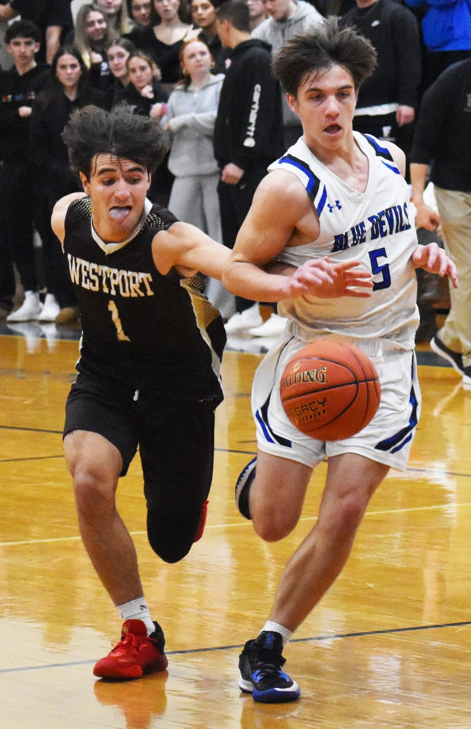 Westport's Hunter Brodeur and Fairhaven's Cameron Burke chase down a loose ball during an earlier game this season.