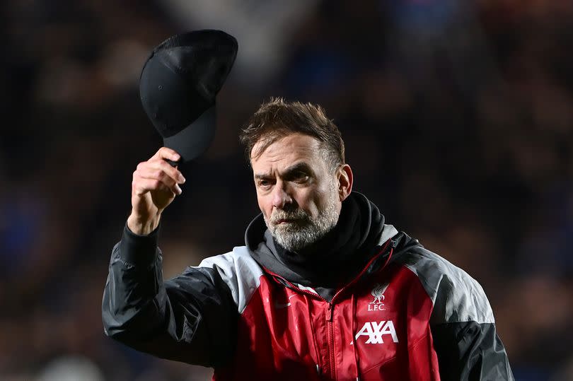 Jurgen Klopp acknowledges the fans by taking his cap off following his side's elimination from the UEFA Europa League after the UEFA Europa League 2023/24 Quarter-Final second leg match between Atalanta and Liverpool FC -Credit:Dan Mullan/Getty Images