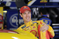 Joey Logano gets into his car to practice for Sunday's NASCAR Cup Series auto race at Charlotte Motor Speedway in Concord, N.C., Saturday, Sept. 28, 2019. (AP Photo/Mike McCarn)