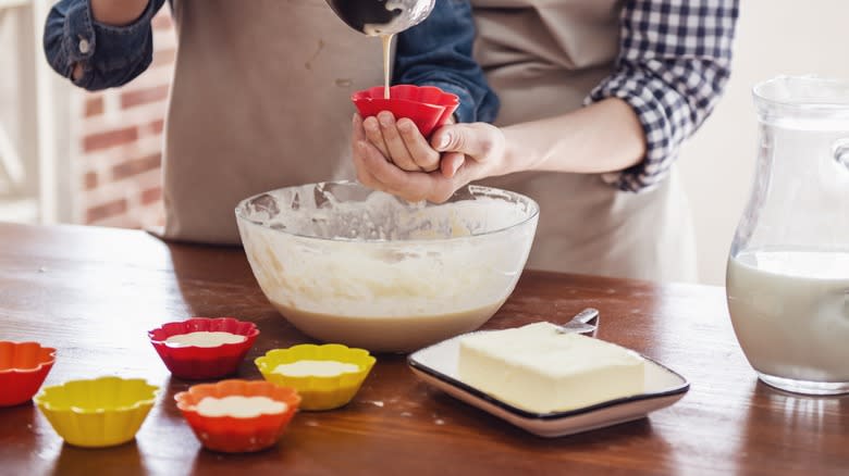 bakers filling muffin cases