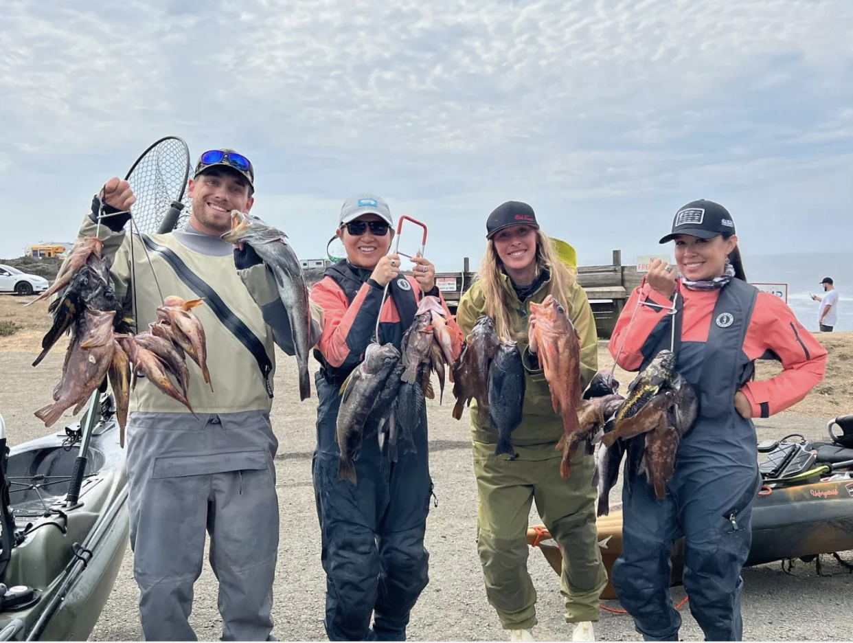 Sage Marshall, Kanani Wong, Annie Nagal and Capt. Virginia Salvador show off the rockfish and one keeper lingcod they caught while fishing from kayaks at Ocean Cove on the Sonoma County Coast on Sept. 11.