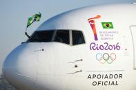 A plane carrying the Olympic flame arrives in Brasilia on May 3, 2016