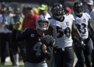 FILE PHOTO: Sep 20, 2015; Oakland, CA, USA; Oakland Raiders quarterback Derek Carr (4) celebrates after an 18-yard run in the third quarter as Baltimore Ravens linebacker Albert McClellan (50) watches at O.co Coliseum. The Raiders defeated the Ravens 37-33. Mandatory Credit: Kirby Lee-USA TODAY Sports / Reuters/File Photo