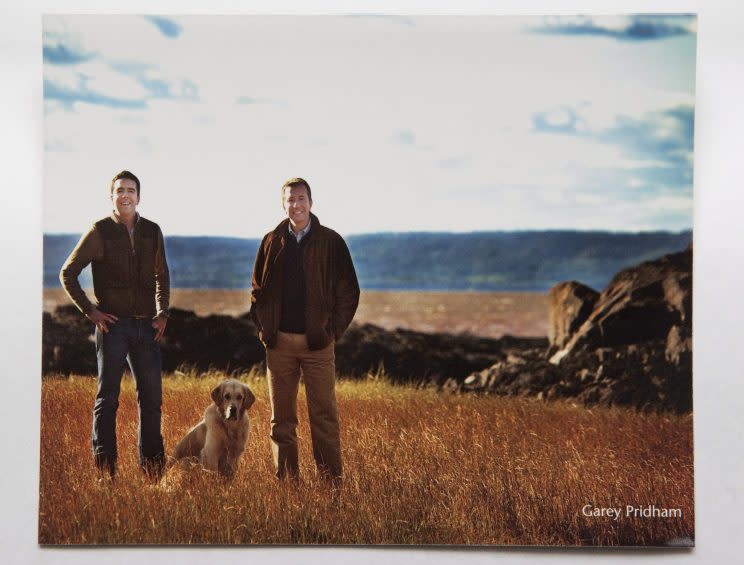 Liberal MP Scott Brison's 2009 Christmas card showing Brison and his partner Maxime St. Pierre standing in a field with their dog Simba. Photo from The Canadian Press. 