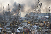 FILE - Aftermath of a massive explosion is seen in in Beirut, Lebanon, Tuesday, Aug. 4, 2020. A Lebanese prosecutor filed charges Tuesday, Nov. 24, 2020 against current and former customs officials over the massive blast at Beirut’s port in August, including a former customs chief who was reportedly the point man for the militant Hezbollah group at the facility. (AP Photo/Hassan Ammar, file)