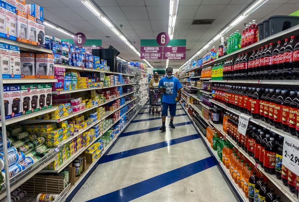 People shop at a 99 Cents store in Santa Monica, California, on September 13, 2022.