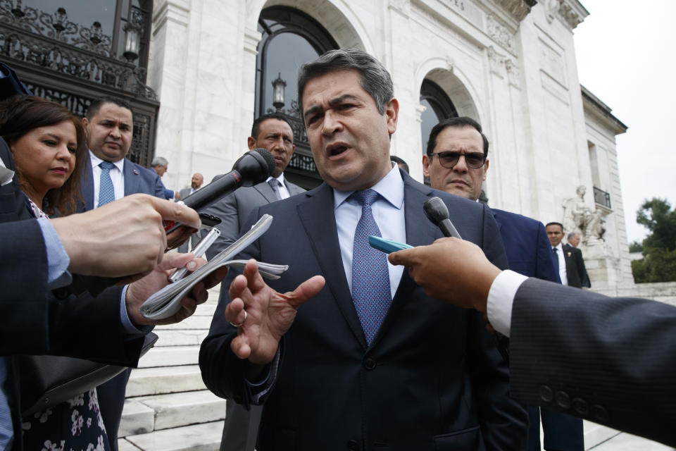 FILE - In this Aug. 13, 2019 file photo, Honduran President Juan Orlando Hernandez speaks to the reporters as he leaves a meeting at the Organization of American States, in Washington. Newly proposed U.S. legislation introduced Tuesday, Feb. 23, 2021, targets Orlando Hernandez as allegations of ties to drug trafficking grow. (AP Photo/Jacquelyn Martin, File)