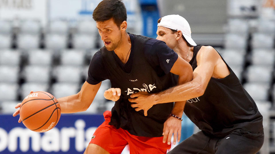 Novak Djokovic and Grigor Dimitrov, pictured here playing basketball.