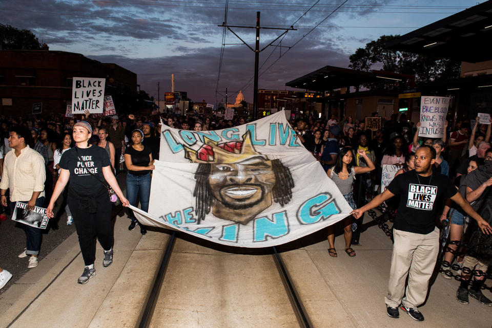 <p>Protestors carry a banner depicting Philando Castile on June 16, 2017 in St Paul, Minnesota. Protests erupted in Minnesota after Officer Jeronimo Yanez was acquitted on all counts in the shooting death of Philando Castile. (Stephen Maturen/Getty Images) </p>